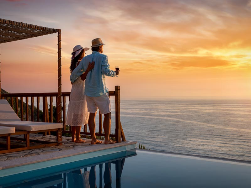 couple on patio looking at ocean