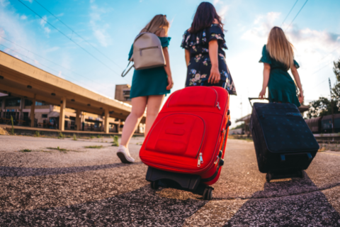 Group of women carrying luggage